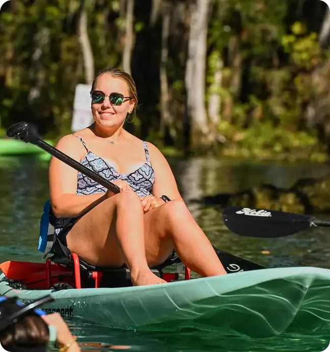 Close-up of a happy kayaker enjoying a scenic river tour